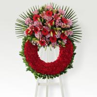Corona de clavel rojo y cabezal variado